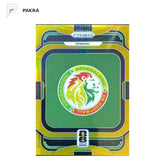 2026 Panini Prizm FIFA World Cup Team Badges SENEGAL 05/10 gold #39 shown on a white PAKRA background.