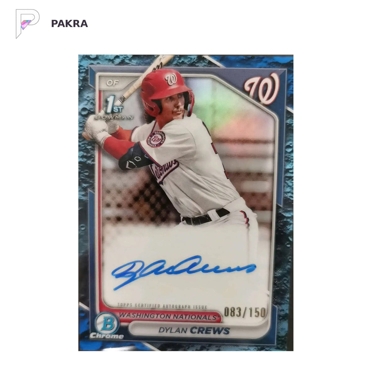 2024 Bowman Dylan Crews Chrome Auto 1st 083/150 Lunar Glow Blue Nationals shown on a white PAKRA background.