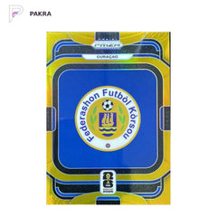 2026 Panini Prizm FIFA World Cup Team Badges CURACAO 06/10 gold #18 shown on a white PAKRA background.