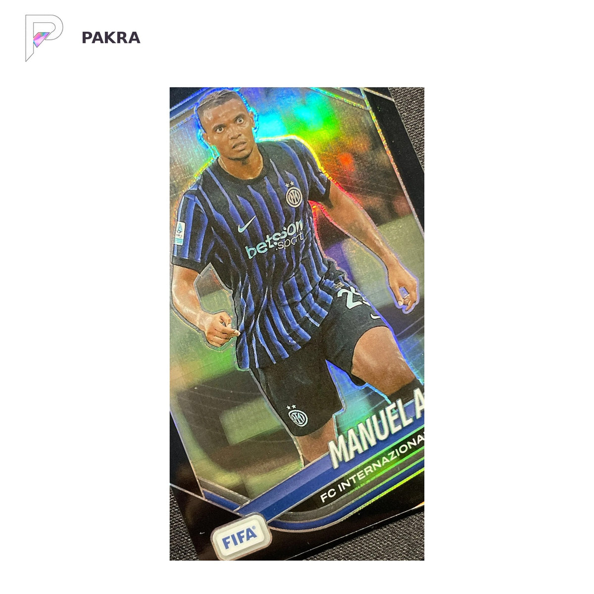 2025-26 Panini Prizm FIFA #84 Manuel Akanji Black 1/1 Internazionale Milano shown on a white PAKRA background.