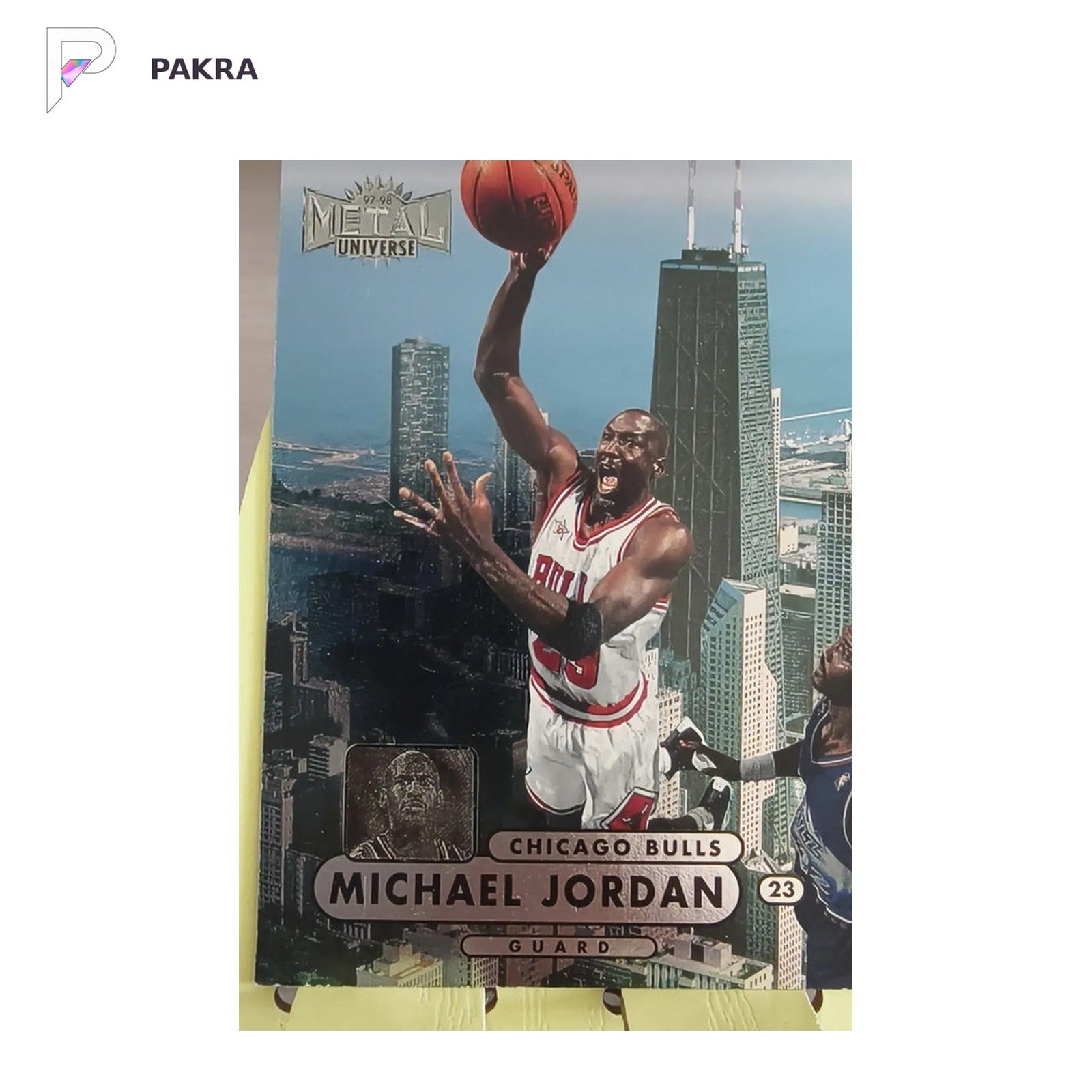 Michael Jordan 1997-98 Skybox Metal Universe Championship Chicago Bulls shown on a white PAKRA background.