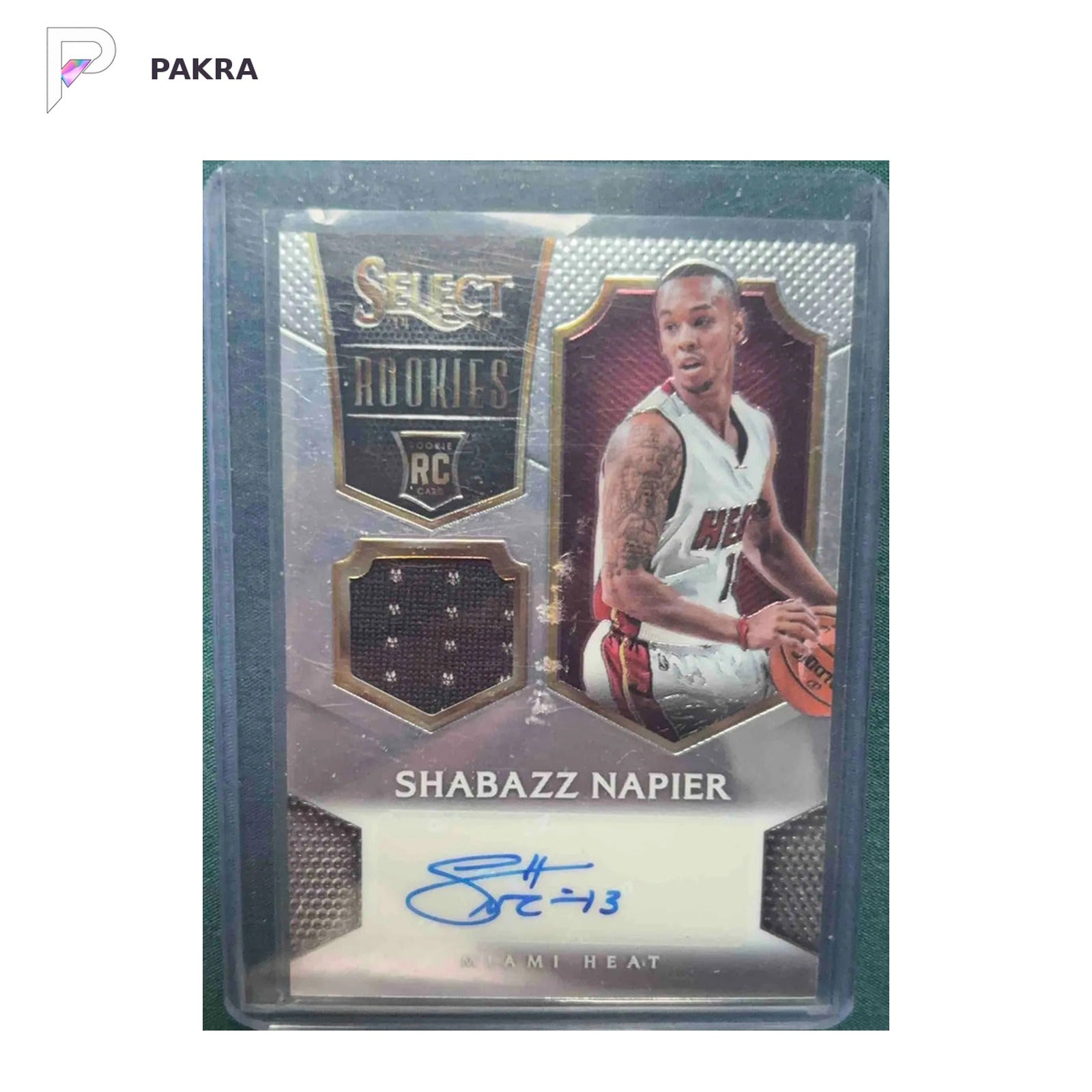 2014 Panini Select Rookies & Prospects #27 Shabazz Napier RC AUTO 26/199 shown on a white PAKRA background.