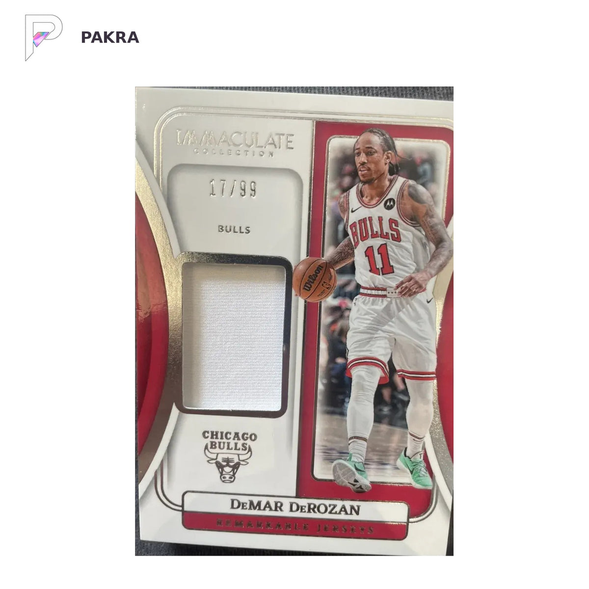 2021 Panini Red Memorabilia #RJ-DD DeMar DeRozan 17/99 shown on a white PAKRA background.