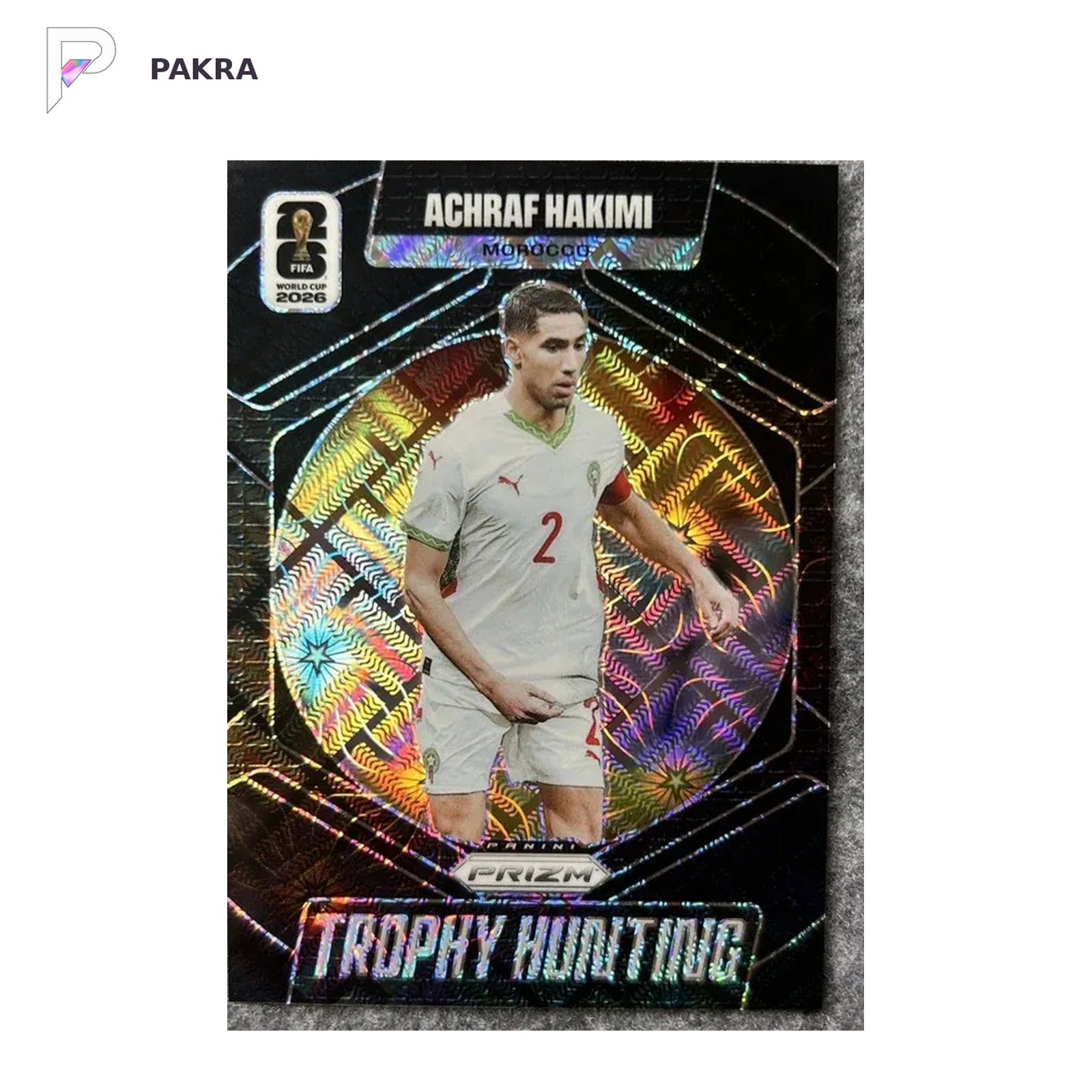 2026 Panini Prizm FIFA WORLD CUP Achraf Hakimi Trophy Hunting Black 1/1 shown on a white PAKRA background.