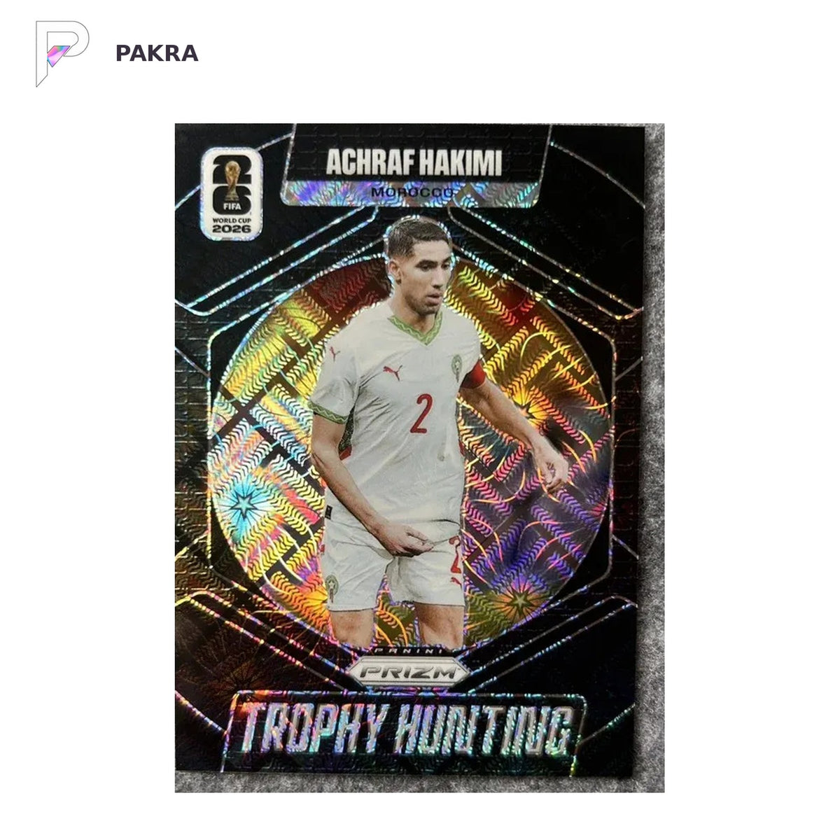 2026 Panini Prizm FIFA WORLD CUP Achraf Hakimi Trophy Hunting Black 1/1 shown on a white PAKRA background.